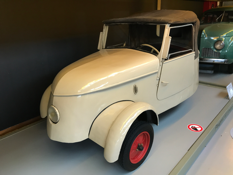 1941 Peugeot VLV electric car with an American Crosley peeking over its shoulder.